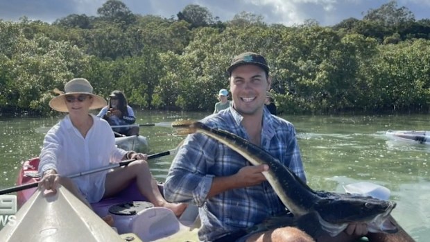 Queensland rangers are hunting for a three-metre crocodile on Minjerribah (North Stradbroke Island) after a reported sighting and have issued a warning to tourists and residents on the island.