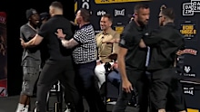 Jim Kambosos lands a punch on Hitchins' trainer Lenny Wilson.
