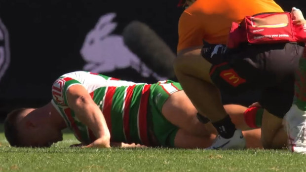Lachlan Ilias lies on the ground after breaking his leg.