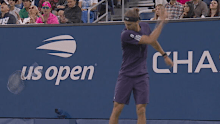 Alexander Zverev smashes his racquet.