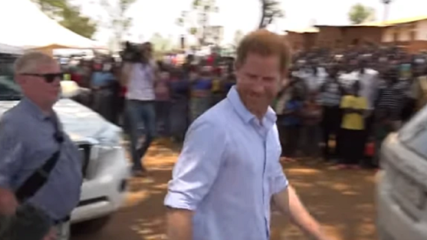 Prince Harry chastises UK reporter for asking unscheduled question.