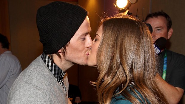 Torah Bright celebrates her gold medal in the women's halfpipe with her fiancee Jake Welch.