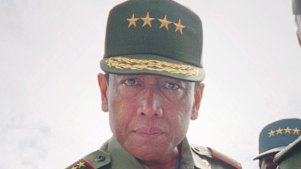 Indonesian Armed Forces chief Gen. Wiranto, center, examines a gun used for firing tear gas canisters in Jakarta in this Monday, March 1, 1999, file photo. 