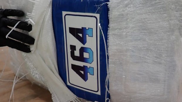 A closeup of a package containing cocaine in Sydney. It has a numbered label reading '464' on it.