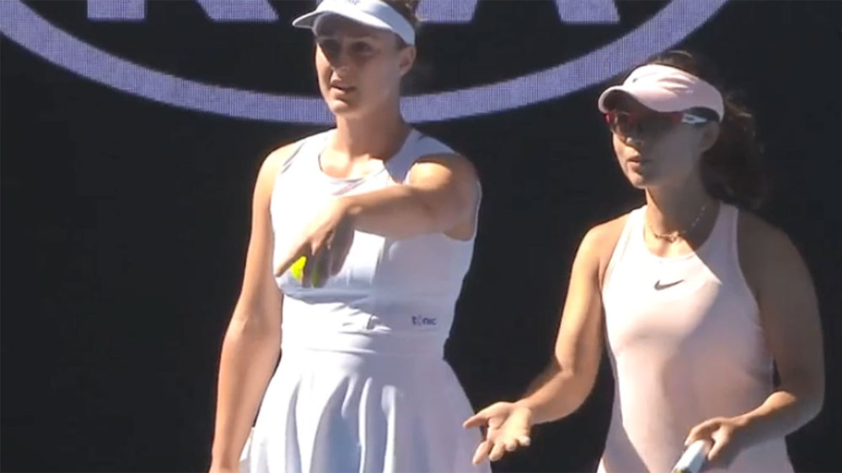 Chair umpire reprimands players before play begins in women's doubles ...