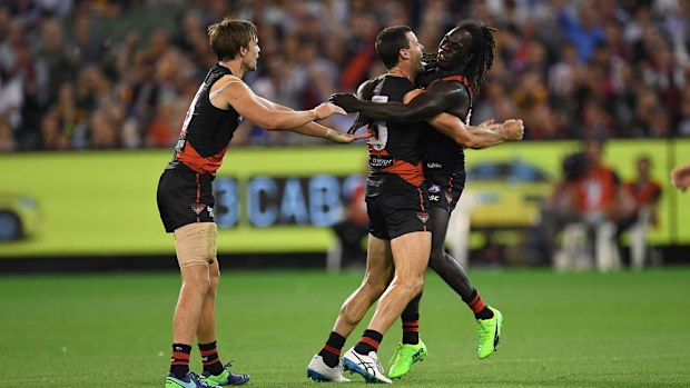 Bombers players celebrate during their win over Hawthorn