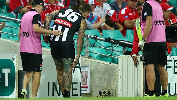 Dane Swan hobbles off the ground after injuring himself against Sydney. (Getty)