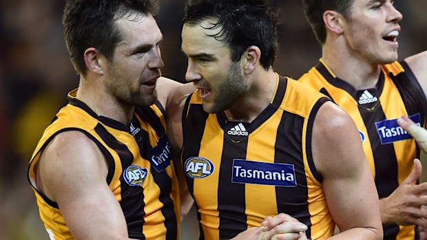 Jordan Lewis (R) with current Hawks captain Luke Hodge. (AAP)