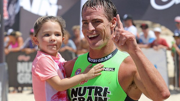 Shannon Eckstein celebrates his win with his daughter. (Getty)