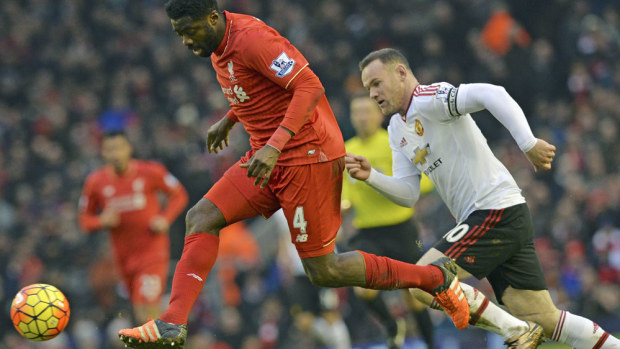 Liverpool defender Kolo Toure in action against Manchester United star Wayne Rooney. (AFP-file)