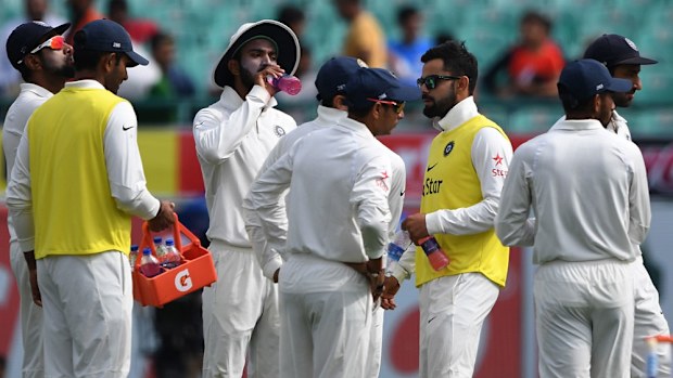 Injured India captain Virat Kohli tries to fire up the troops.