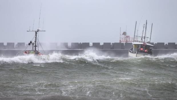Fishing boats moored inside Port Taranaki have not escaped the ravages of Cyclone Gita.
