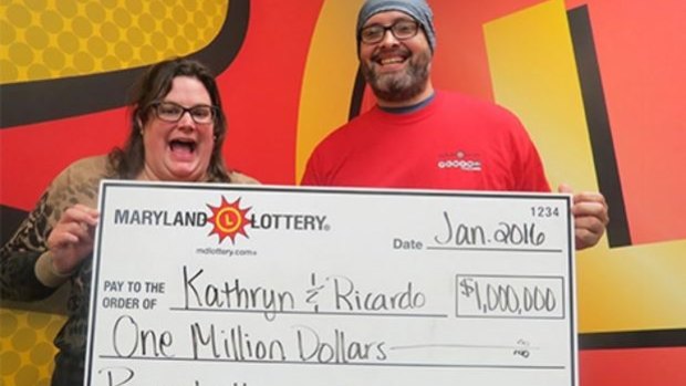Kathryn and Ricardo with their oversized lottery cheque.