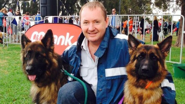 Mr Cowper said he'd even support one of Joe Francis' dogs over Premier Barnett. Pictured is Mr Francis with his german shepherds Stormy and Rex.