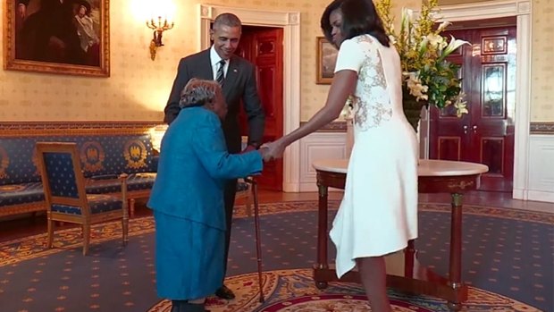 "I tell you, I am so happy," she said, looking up at Barack Obama before turning to the first lady. "A black president, yay, and his black wife."