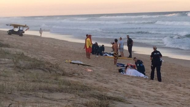 Lifeguards at the scene of the emergency Mount Coolum beach.