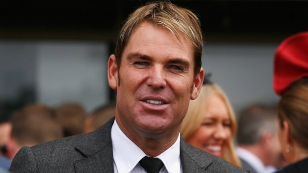 Shane Warne enjoys Cox Plate day at Moonee Valley racecourse in October 2014. 