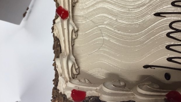 This cake was delivered with a hair on it claims a franchisee.