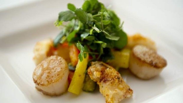 Spicy daikon and carrot give the marinated scallops and calamari with vegetable achar and watercress dish a real kick.