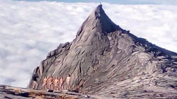 Photos of tourists who stripped on Mt Kinabalu in Malaysian Borneo went viral on social media.