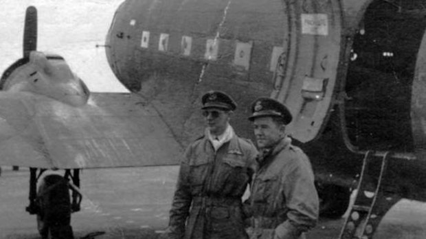 David Evans, left, with RAAF navigator, Flight Lieutenant Kevin Carrick, waiting as their plane is unloaded in Berlin during the airlift in 1948.