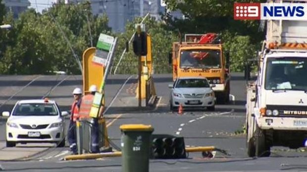 Traffic chaos: Power lines down over Lygon Street.