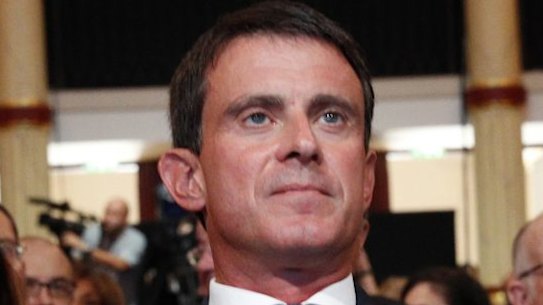 French Prime Minister Manuel Valls, centre, with French President Francois Hollande, right, and French Foreign Minister Jean-Marc Ayrault. 