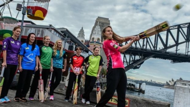 Having a go: Ellyse Perry takes a swing at the launch of this season's Women's BBL.