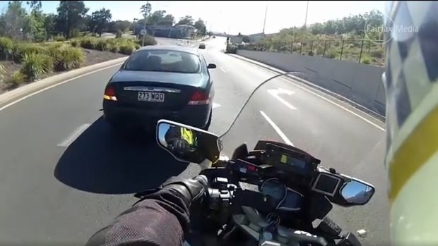 An incident in which a motorbike cop was knocked off his bike was caught on camera.