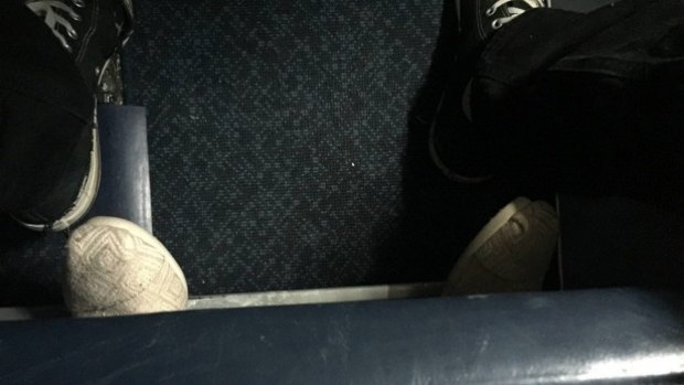 Space invasion: Passenger takes his legroom issues too far.