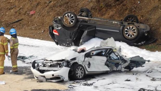 The white car crushed by a truck on the Calder Freeway.