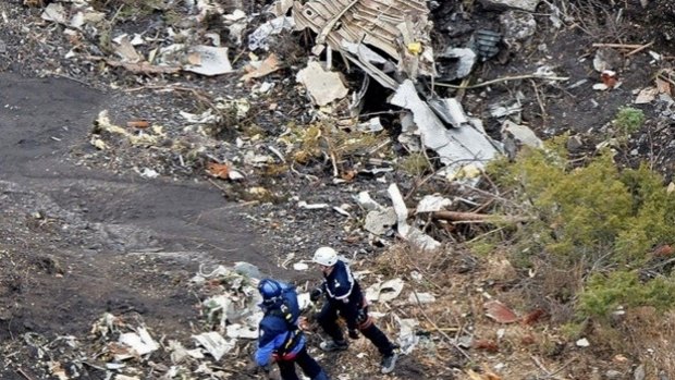 Investigators search through the wreckage of Germanwings Flight 9525 in the French Alps, which crashed at high-speed on Tuesday morning.