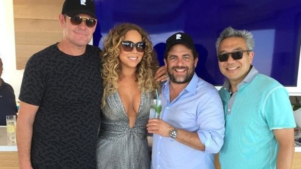 James Packer and Mariah Carey with Brett Ratner (second from right) on Packer's super yacht in January.