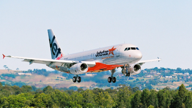 Jetstar has apologised after five passengers fainted on a grounded flight.