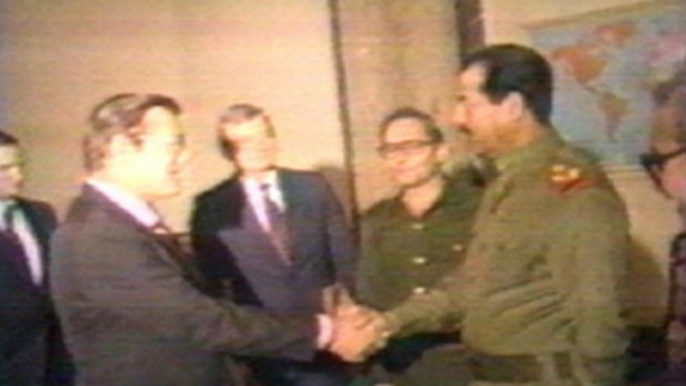 Iraqi President Saddam Hussein greets Donald Rumsfeld, then special envoy of US president Ronald Reagan, in Baghdad on December 20, 1983. 