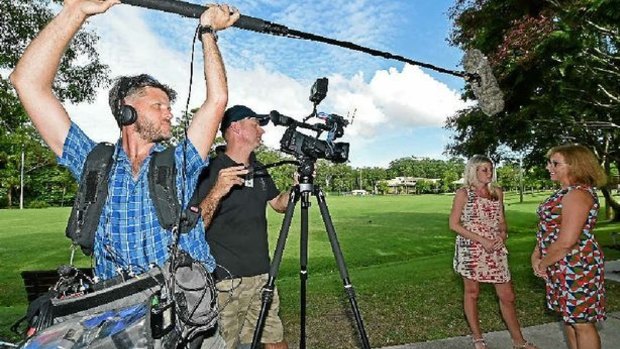 Sound recordist Angus Rex and producer/director Gareth Lee filming at Matthew Flinders Anglican College, with Briton Helen Holroyd, visiting Australia for the TV program, speaking with teaching assistant Heather Greeff.