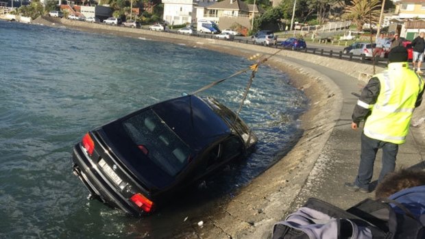 The BMW is recovered from the off Evans Bay Parade in Wellington Harbour. 