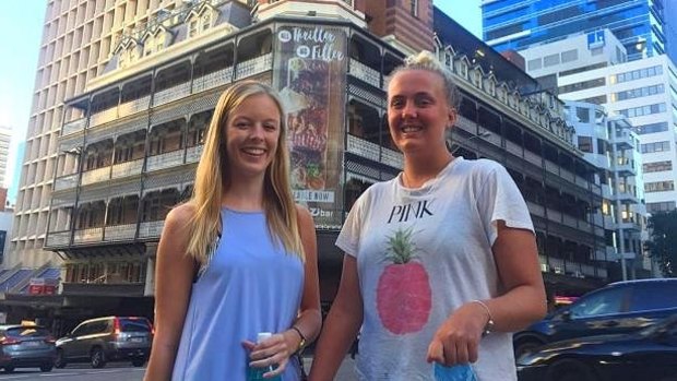 Loving Queensland's winter sun in Brisbane are backpackers Emma O'Toole (left) from Ireland and Sara Winberg from Sweden. 