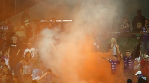 Revolt: Perth Glory fans set off flares during Friday night's loss to the Sky Blues.