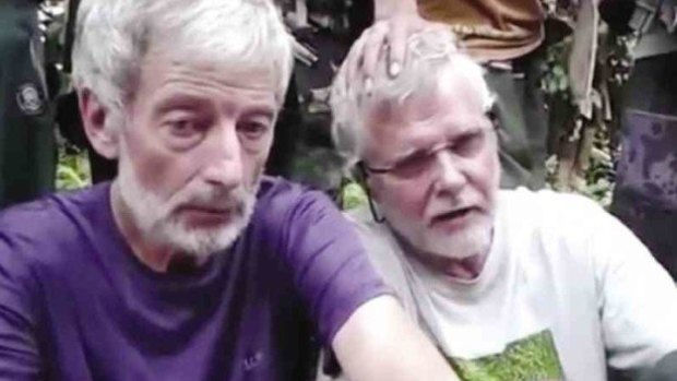 Canadians Robert Hall and John Ridsdel in a video still sent by Abu Sayyaf to media outlets. 