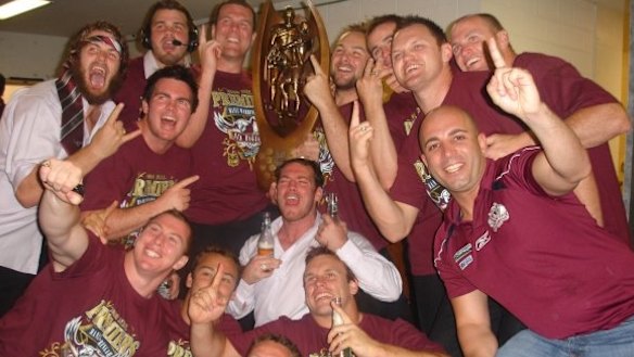 Robert Melhem, right with finger raised, celebrating with Manly players after they won the grand final in 2008.
