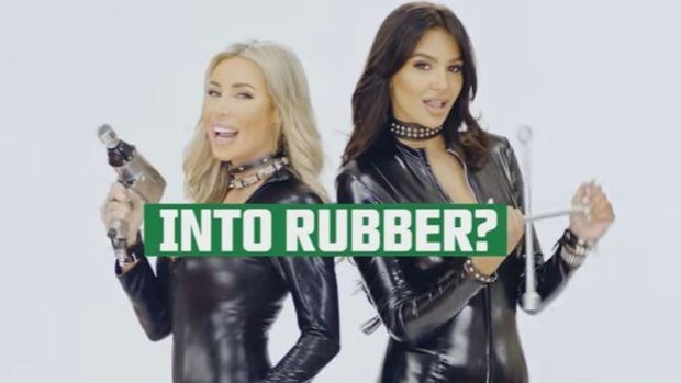 Ultra Tune Australia ad with two women dancing in tight outfits, with the tagline 'we're into rubber'.