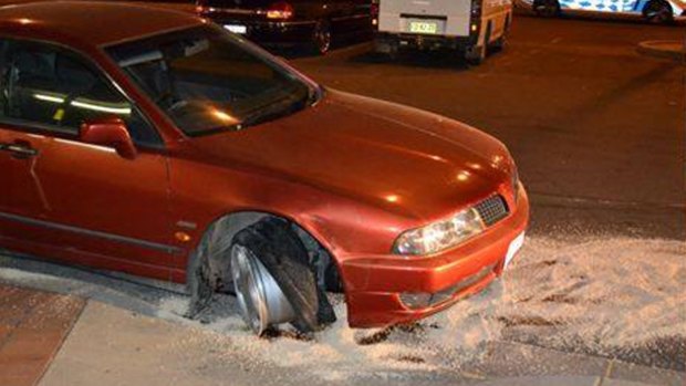 A red Mitsubishi Magna crashed into the Dickson Library Tuesday night.