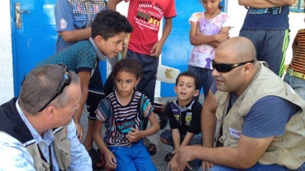 Mohammed al-Halabi meets children displaced during Israel's 2014 Protective Edge offensive in the Gaza Strip. 