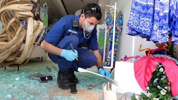 Probed ... police investigate the break-in at the Paddington boutique in 2016. 