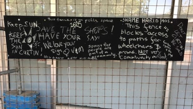 Signs of protests on the fences around the Curtin shop.