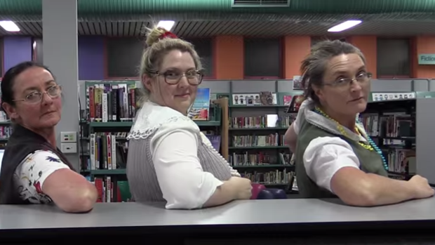 The librarians raided the library's lost property to find glasses to wear in the clip.