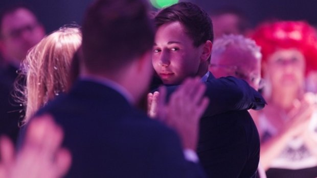 Stuart Kelly receives a standing ovation at the Take Kare gala dinner.