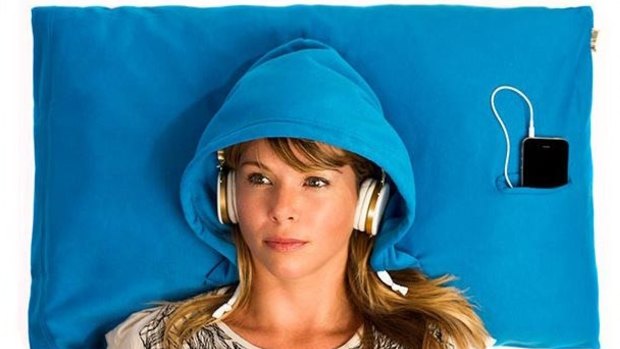 The Hoodie pillowcase comes with a small pocket for a smartphone and portholes for headphones.
