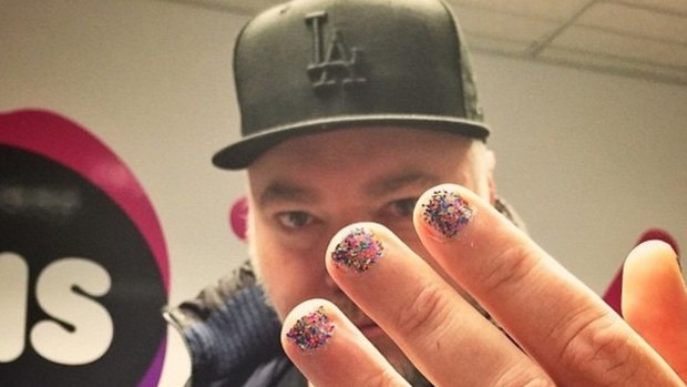 Kyle Sandilands shows off his painted fingernails for Bruce Jenner.